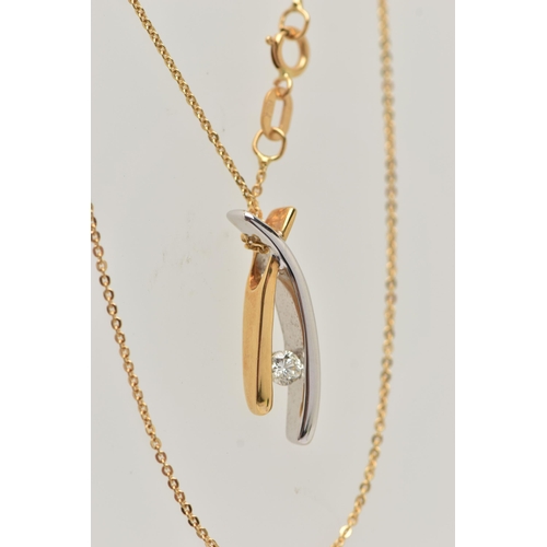 33 - A MODERN 18CT YELLOW AND WHITE GOLD DIAMOND PENDANT WITH CHAIN, the plain polished pendant of cross ... 