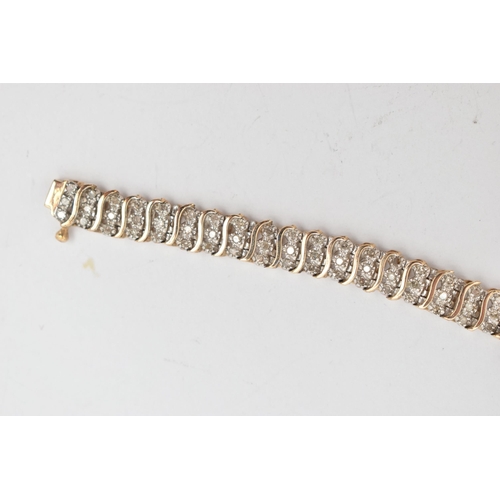 38 - A 9CT GOLD DIAMOND BRACELET, designed as a series of single-cut diamonds, interspaced by plain polis... 