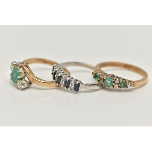 46 - THREE 9CT GOLD GEM SET RINGS, a three stone emerald yellow gold ring, hallmarked 9ct London, ring si... 