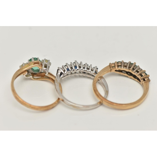 46 - THREE 9CT GOLD GEM SET RINGS, a three stone emerald yellow gold ring, hallmarked 9ct London, ring si... 