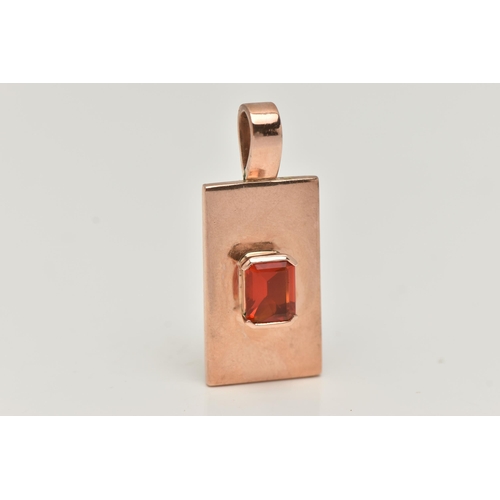 5 - A 9CT GOLD RECTANGULAR PENDANT, polished pendant set with a central, rectangular cut orange stone wi... 