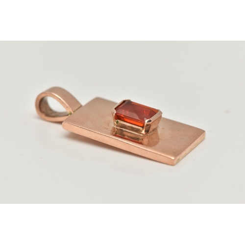 5 - A 9CT GOLD RECTANGULAR PENDANT, polished pendant set with a central, rectangular cut orange stone wi... 