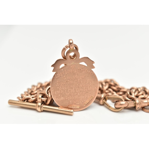 101 - A 9CT ROSE GOLD DOUBLE ALBERT CHAIN WITH FOB MEDAL, each link stamped 9.375, fitted with a T-bar hal... 