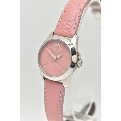 108 - A 'GUCCI G TIMELESS' WRISTWATCH, quartz movement, round pink leather dial with embossed Gucci logo, ... 