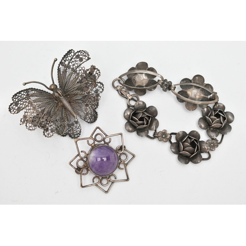 111 - THREE ITEMS OF WHITE METAL JEWELLERY, to include a white metal flower bracelet, stamped 'Sterling, C... 