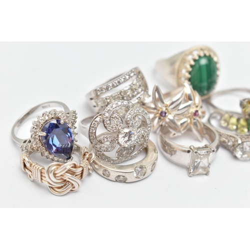 115 - TEN RINGS, to include a large silver malachite cabochon dress ring, claw set within a beaded surroun... 