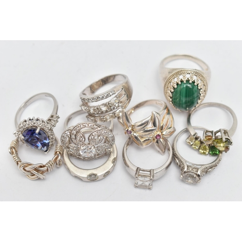 115 - TEN RINGS, to include a large silver malachite cabochon dress ring, claw set within a beaded surroun... 