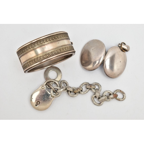 117 - THREE ITEMS OF WHITE METAL JEWELLERY, to include a wide hinged bangle, fitted with a push button cla... 