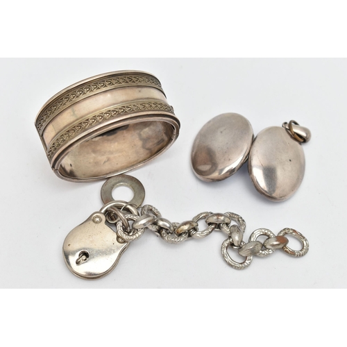 117 - THREE ITEMS OF WHITE METAL JEWELLERY, to include a wide hinged bangle, fitted with a push button cla... 