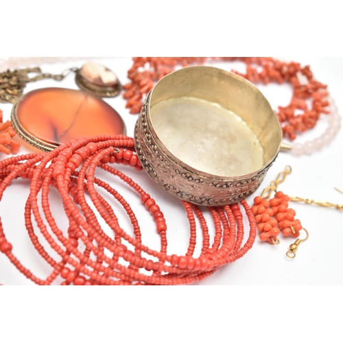 131 - A COLLECTION OF WHITE METAL CORAL, GLASS BEAD AND GEM-SET JEWELLERY, to include an expandable red gl... 