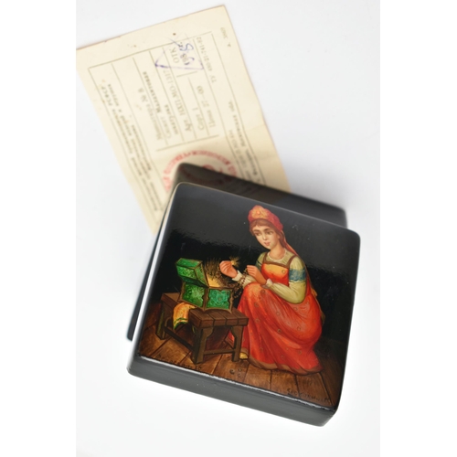 138 - A RUSSIAN BLACK LACQUER BOX, with painted scene to the hinged lid, and Russian receipt, measuring ap... 