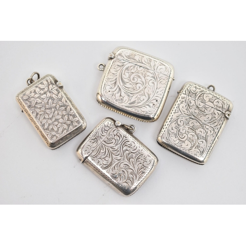 142 - FOUR LATE 19TH TO EARLY 20TH CENTURY SILVER VESTAS, all with engraved foliate decoration, two with e... 