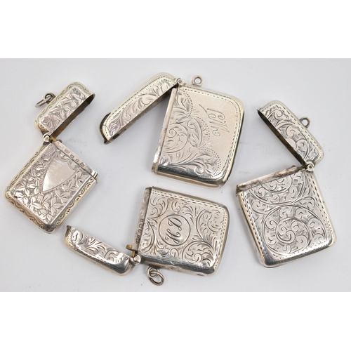 142 - FOUR LATE 19TH TO EARLY 20TH CENTURY SILVER VESTAS, all with engraved foliate decoration, two with e... 