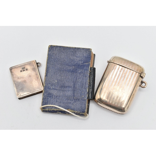 146 - THREE EARLY 20TH CENTURY SILVER ACCESSORIES, to include an Edwardian embossed silver fronted noteboo... 