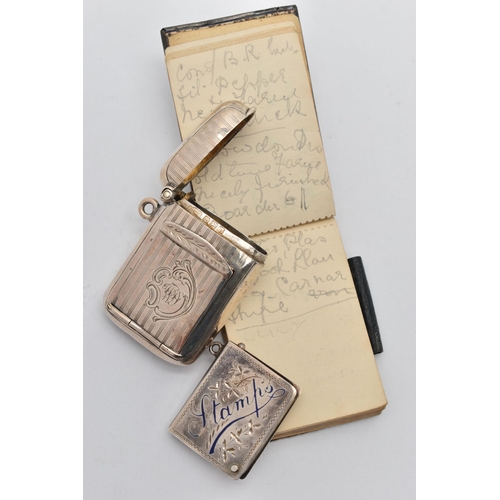 146 - THREE EARLY 20TH CENTURY SILVER ACCESSORIES, to include an Edwardian embossed silver fronted noteboo... 