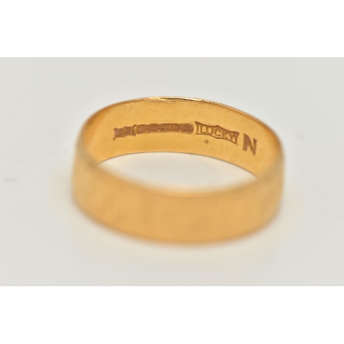 74 - A 22CT GOLD TEXTURED BAND, approximate band width 5.9mm, hallmarked 22ct Sheffield, ring size Q lead... 