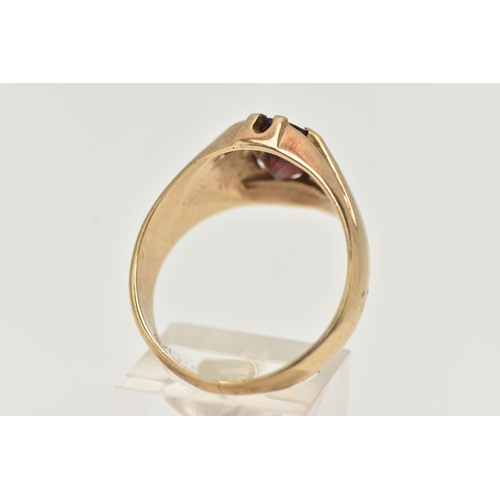 77 - A GENTS 9CT GOLD GARNET RING, gypsy set, oval cut garnet, to a polished band, hallmarked 9ct possibl... 