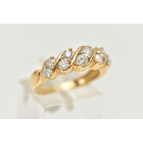 80 - AN 18CT GOLD DIAMOND RING, half eternity style set with a double row of round brilliant cut diamonds... 