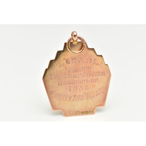 97 - A 9CT GOLD FOB MEDAL, engine turned pattern, with engraved monogram, fitted with a jump ring for sus... 