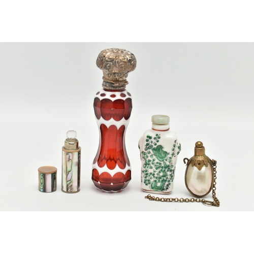 154 - FOUR SCENT BOTTLES, to include a red and white glass scent bottle of waisted form with white metal e... 