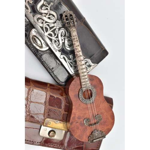 161 - TWO SILVER MOUNTED PURSES AND A MINITURE GUITAR, the first a black croc purse with floral silver mou... 