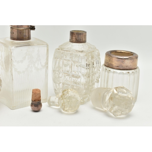 177 - FOUR SILVER TOPPED GLASS JARS, glass scent bottle with stopper and silver collar, hallmarked London,... 