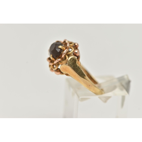 211 - A YELLOW METAL SMOKY QUARTZ RING, set with an oval cut smoky quartz, in a four claw open work settin... 