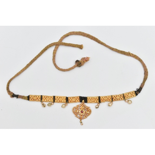 212 - AN INDIAN NECKLACE, designed with a central fancy floral and beaded pendant with central ruby suspen... 