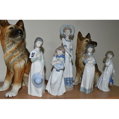 324 - FIVE NAO FIGURES AND TWO FIGURES OF GERMAN SHEPHERD DOGS, the Nao figures comprising a girl with a p... 