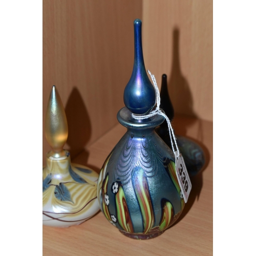 339 - THREE OKRA SCENT BOTTLES, the tallest an iridescent blue with small white flowers, base bears etched... 