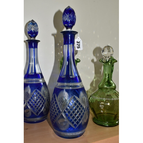 375 - A GROUP OF BOHEMIAN GLASS DECANTERS, comprising a pair of 20th Century Bohemian blue flash glass dec... 