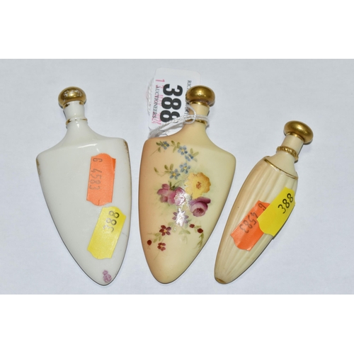 388 - A GROUP OF THREE ROYAL WORCESTER PORCELAIN SCENT FLASKS, comprising a shield shaped bottle, hand pai... 