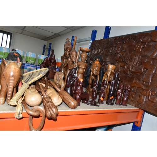 432 - A LARGE COLLECTION OF HAND CRAFTED AFRICAN WOOD STATUES FROM LIBERIA ETC, including a large panel de... 