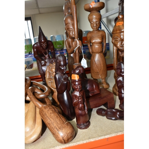 432 - A LARGE COLLECTION OF HAND CRAFTED AFRICAN WOOD STATUES FROM LIBERIA ETC, including a large panel de... 