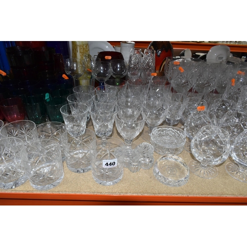 440 - A LARGE SELECTION OF CRYSTAL CUT GLASS AND COLOURED GLASS VESSELS, including two sets of Tudor Cryst... 