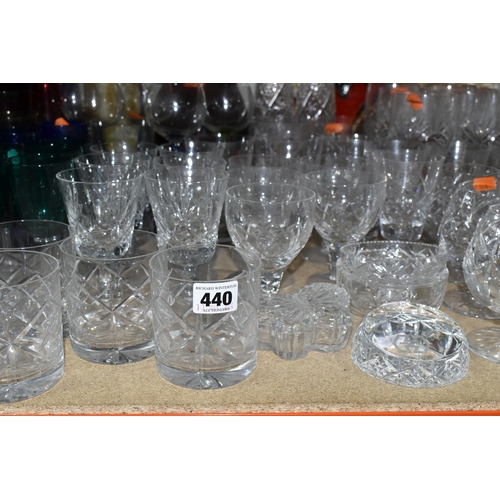 440 - A LARGE SELECTION OF CRYSTAL CUT GLASS AND COLOURED GLASS VESSELS, including two sets of Tudor Cryst... 