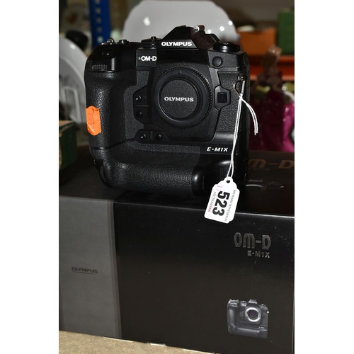 523 - AN OLYMPUS OM-D E-M1X MIRRORLESS 4/3 CAMERA BODY, complete with battery charger (no UK power cable),... 