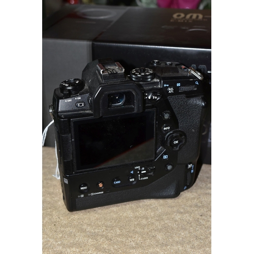 523 - AN OLYMPUS OM-D E-M1X MIRRORLESS 4/3 CAMERA BODY, complete with battery charger (no UK power cable),... 