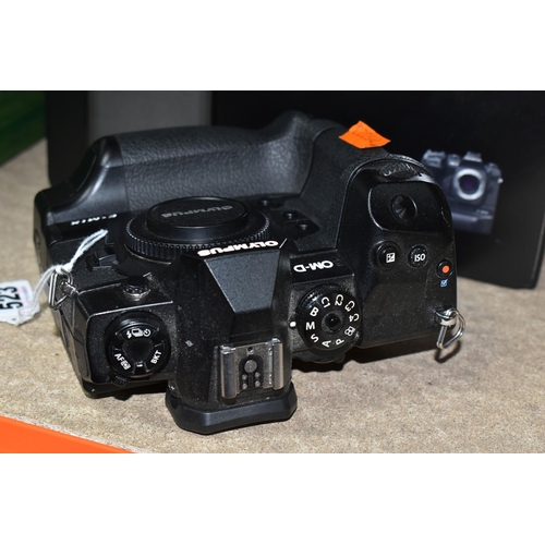 523 - AN OLYMPUS OM-D E-M1X MIRRORLESS 4/3 CAMERA BODY, complete with battery charger (no UK power cable),... 