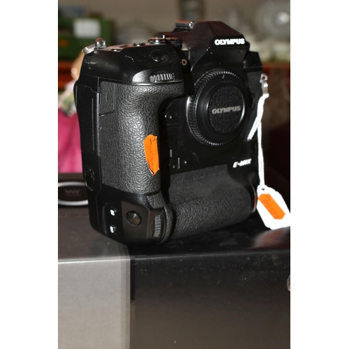 523 - AN OLYMPUS OM-D E-M1X MIRRORLESS 4/3 CAMERA BODY, complete with battery charger (no UK power cable),... 