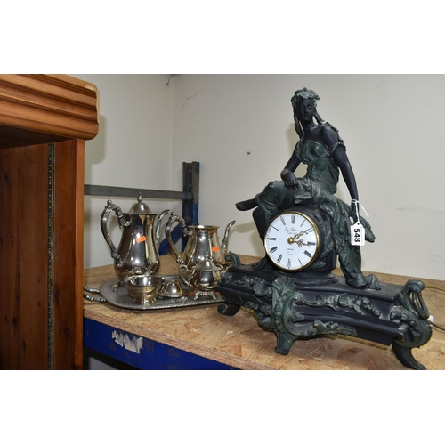 548 - A FIGURAL MANTEL CLOCK AND AN ONEIDA PLATED TEA AND COFFEE SET, comprising a resin figural mantel cl... 