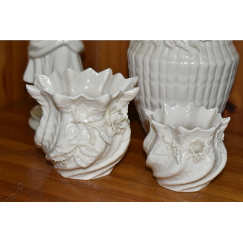 559 - FOUR PIECES OF BELLEEK GIFTWARE, comprising a figure of a girl carrying a basket, 9th mark 1997-2000... 