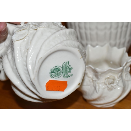 559 - FOUR PIECES OF BELLEEK GIFTWARE, comprising a figure of a girl carrying a basket, 9th mark 1997-2000... 