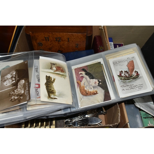 590 - TWO BOXES OF POSTCARDS AND SUNDRIES, to include a postcard album containing over one hundred and fif... 