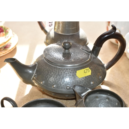 475 - AN EARLY 20TH CENTURY ARTS & CRAFTS PLANISHED PEWTER TEA SET, comprising teapot, hot water jug, milk... 