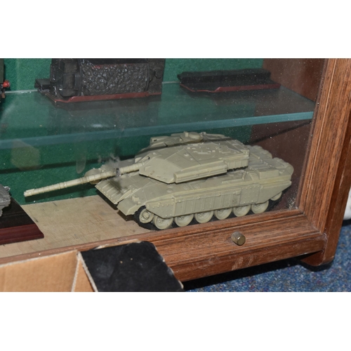 595 - A WALL MOUNTED WOODEN GLASS FRONTED SHELVING UNIT CONTAINING MODEL RAILWAY ITEMS, to include unboxed... 