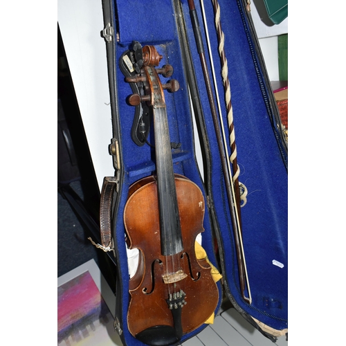 605 - A CASED VIOLIN, two piece back, ebonized fingerboard, in a hard fitted case with two bows - one mark... 