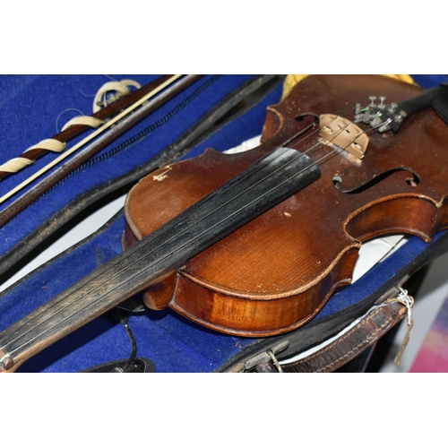 605 - A CASED VIOLIN, two piece back, ebonized fingerboard, in a hard fitted case with two bows - one mark... 