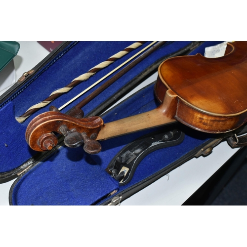 605 - A CASED VIOLIN, two piece back, ebonized fingerboard, in a hard fitted case with two bows - one mark... 