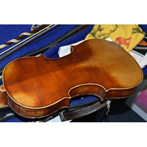 605 - A CASED VIOLIN, two piece back, ebonized fingerboard, in a hard fitted case with two bows - one mark... 